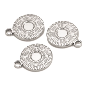 Detailed macro view of silver stainless steel sun ring pendants with Roman numerals