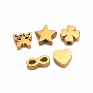Golden stainless steel DIY charms including heart, star, and clover shapes for jewelry making