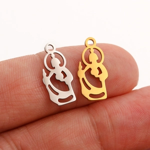 Macro view of gold and silver plated mini Buddha pendants for DIY jewelry making