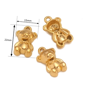 Detailed views of 3D teddy bear charm pendants with bow detail and size measurements