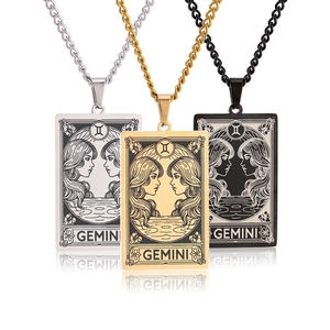 Gemini tarot card necklaces in gold, silver, and black stainless steel with mirror reflections