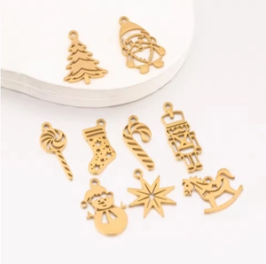Golden Christmas charms set featuring snowman and tree shapes for DIY jewelry making
