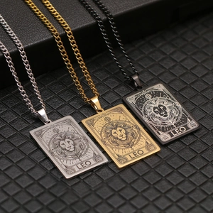 Three Leo zodiac dog tag necklaces in silver, gold, and black with lion head engraving