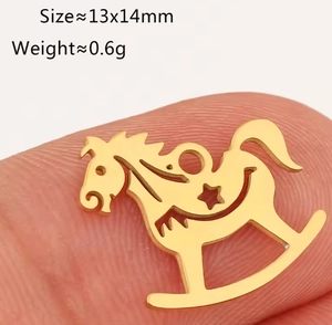 Macro shot of a 13x14mm gold rocking horse pendant charm for DIY jewelry making