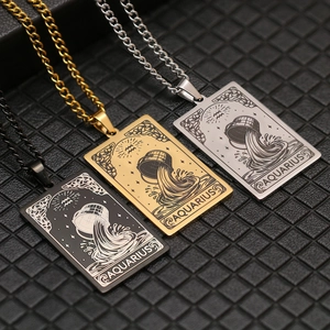 Detail of Aquarius zodiac tarot necklaces in black, gold, and silver stainless steel