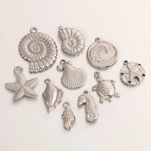 Detailed set of 10 silver sea animal pendants including starfish and turtle charms