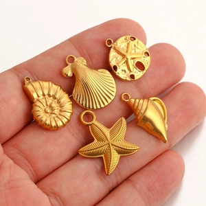 Detail of gold-plated stainless steel sea shells, starfish, and turtle DIY jewelry charms
