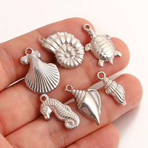 Polished stainless steel ocean animal pendants including sea turtle and seahorse charms