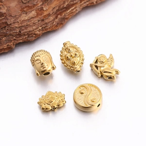 DIY gold stainless steel beads in Buddha, Angel, Lotus, and Tai Chi shapes for jewelry making