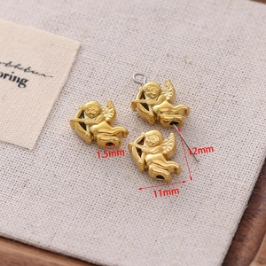 Macro view of golden cupid angel charm with 11mm dimensions for DIY jewelry making