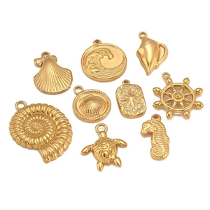 9-piece golden stainless steel ocean charms set featuring seahorse, turtle, and nautilus