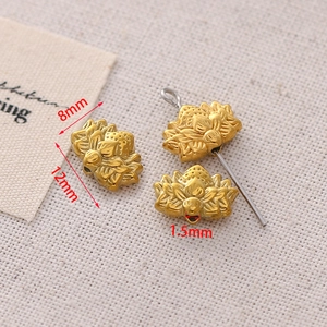 Detailed macro of golden lotus beads showing 12x8mm dimensions and 1.5mm hole size