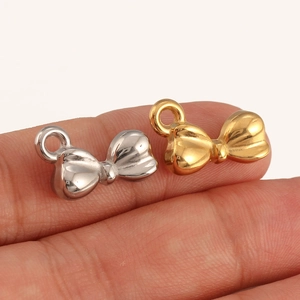 Polished bow pendant accessories in gold and silver finish for DIY jewelry crafting
