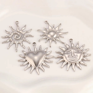 Silver stainless steel sun pendants set featuring spiral, heart, and face designs