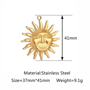 Golden stainless steel sun pendant with face detail and radial rays, size 37mm x 41mm