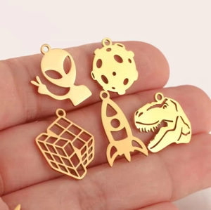Golden stainless steel charm set featuring alien, rocket, and dinosaur silhouettes