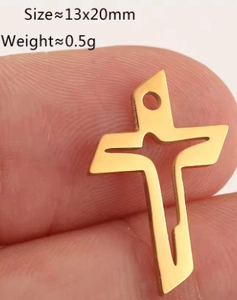 Macro shot of a small 13x20mm gold-plated stainless steel hollow cross charm