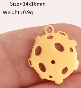 Detail of 14x16mm gold stainless steel round hollow pendant with meteorite surface texture