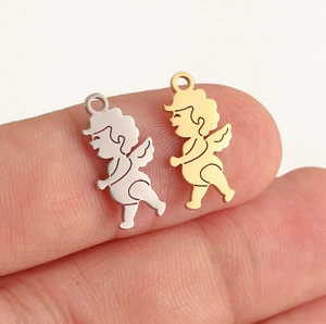 Macro view of gold and silver polished stainless steel angel charms for DIY jewelry making