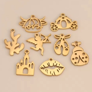 Set of 8 gold stainless steel fairy tale pendants including castle and ballet shoes