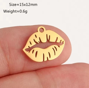 Macro shot of gold lips pendant charm for DIY jewelry making with dimensions 15x12mm