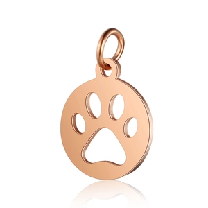 Detailed macro view of rose gold stainless steel round pendant with hollow pet paw print