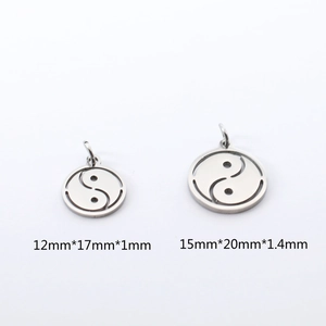 Detailed view of hollow Yin Yang Tai Chi pendants in two sizes for DIY jewelry making