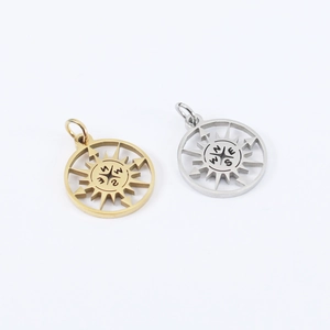 Detailed view of hollow compass pendants in gold and silver finish with sunburst design