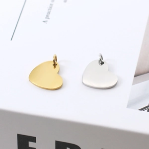 Gepolijste hartvormige hangers in goud en zilver staal met ringetjes voor DIY-sieraden