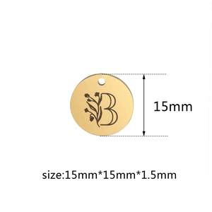 Polished gold 15mm round stainless steel pendant with flower pattern and letter B