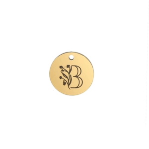 Macro shot of 15mm gold polished stainless steel pendant with letter B floral engraving