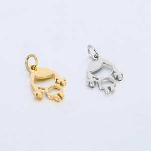 Detailed view of polished little girl charms in gold and silver for DIY jewelry making