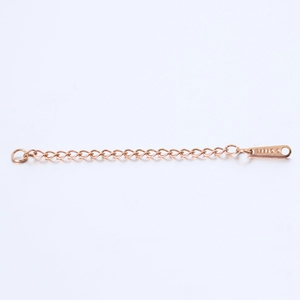 Detail of rose gold stainless steel extender chain with water drop tag and S.STEEL stamp
