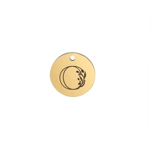 Detailed macro view of 15mm polished gold stainless steel round charm with letter O