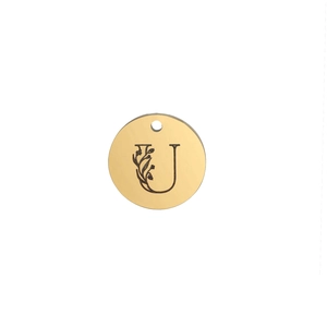 Macro shot of 15mm polished stainless steel round pendant with floral letter U engraving