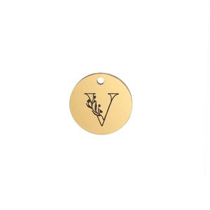 Macro detail of 15mm mirror polished gold stainless steel pendant with engraved letter V and floral