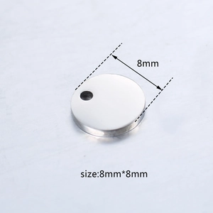 Macro view of a 8mm round stainless steel blank tag for jewelry DIY and engraving