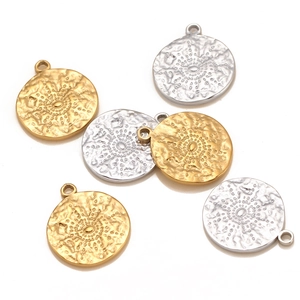 Golden and silver stainless steel sun coin charms with embossed radial patterns for jewelry