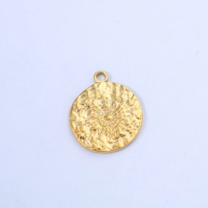 Detailed close-up of golden sunburst pendant with hammered metal texture for DIY jewelry