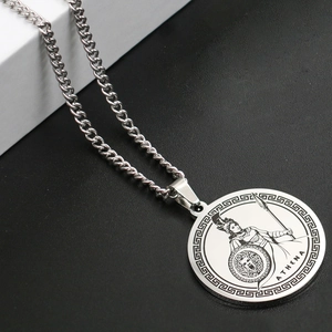 Macro detail of silver Athena Greek goddess pendant necklace with polished curb chain