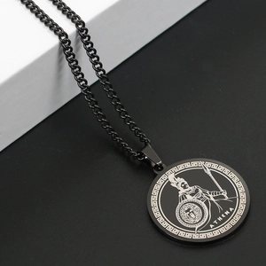 Macro detail of black stainless steel Athena pendant with Greek key pattern and curb chain