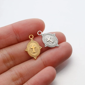 Polished gold and silver stainless steel oval cross pendants with sunburst pattern details