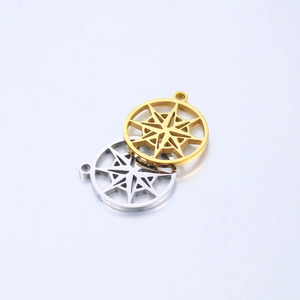 Detailed macro view showing gold and silver compass pendants for DIY jewelry making