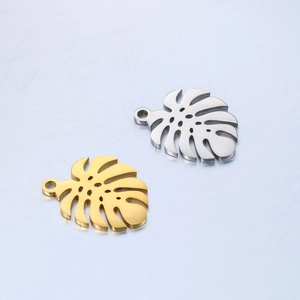 Polished stainless steel monstera leaf charms in gold and silver for DIY jewelry making
