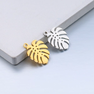 Polished stainless steel monstera leaf pendants in gold and silver for DIY jewelry making