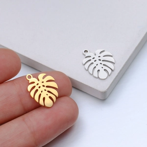 Polished hollow monstera leaf pendants in gold and silver finish for DIY jewelry
