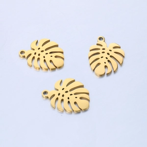 Three gold stainless steel monstera leaf charms with circular hanging holes for DIY jewelry