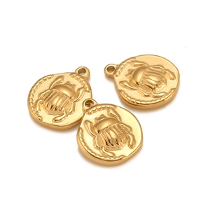 Detailed macro view of three vintage gold scarab beetle charms for DIY jewelry making