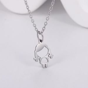 Close-up of a hollow outline little girl pendant on a sleek silver chain necklace