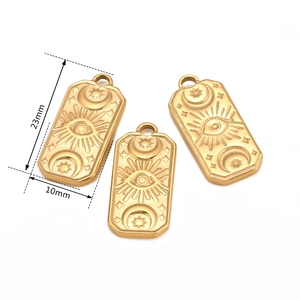 Three gold celestial rectangular charms with sun, moon, and evil eye engravings for DIY jewelry